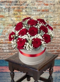 Stunning Hatbox arrangement of 12 large Headed  red roses with Gypsophila