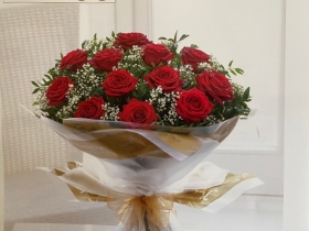 12 Beautiful Large Headed long stem red roses with Gypsophila